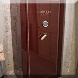 Z02. Liberty Safe combination lock gun safe. Model LT-23. 60”h x 30”w x 22”d 